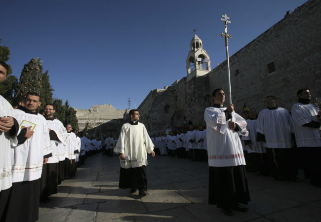 During Christmas celebrations, Catholic clergy participate in a procession outside the Church of the in the biblical city of Bethlehem, West Bank, on December 24th 2007. (Photo by Heidi Levine).