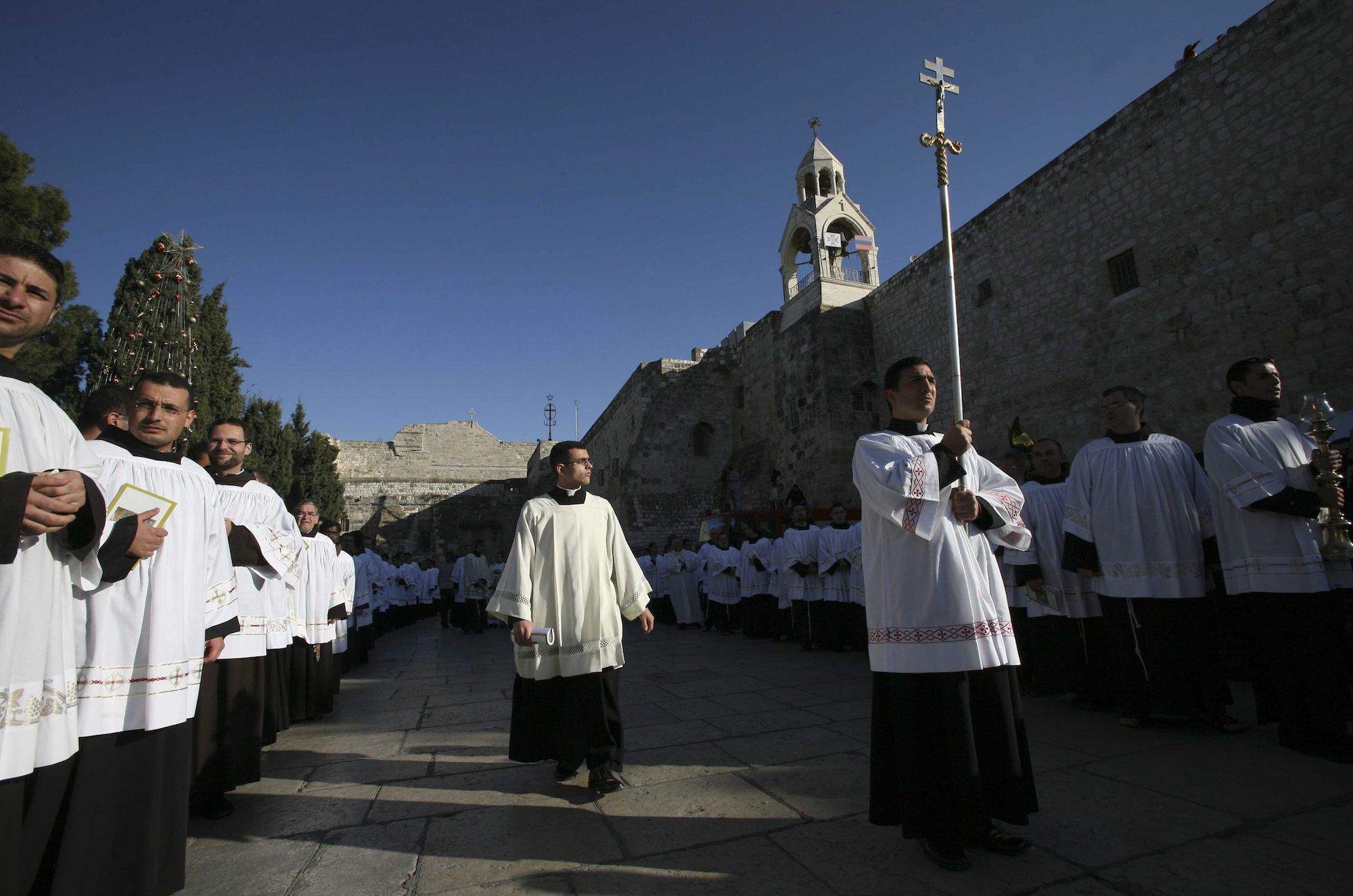 During Christmas celebrations, Catholic clergy participate in a procession outside the Church of the in the biblical city of Bethlehem, West Bank, on December 24th 2007. (Photo by Heidi Levine).