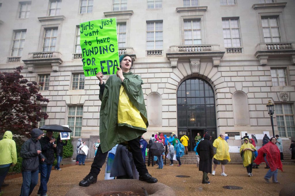 A high school student, Madeleine Arena, wants more funding for the EPA at the Science March in DC.