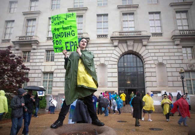A high school student, Madeleine Arena, wants more funding for the EPA at the Science March in DC.