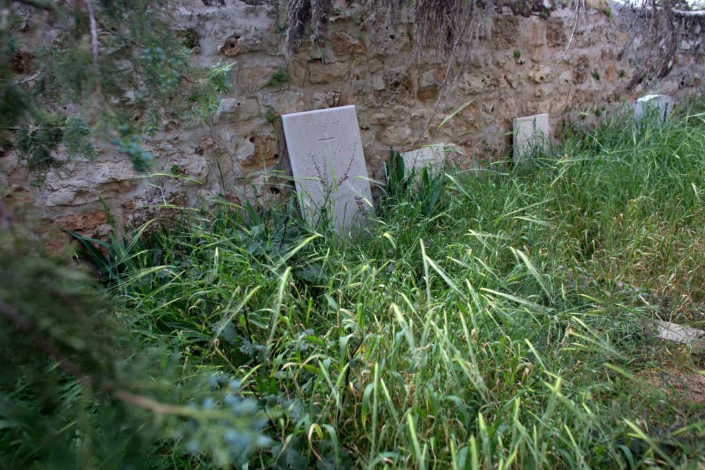 Christian tombstones are seen in a neglected Christian cemetery in Palestinian West Bank village of Emmaus. (Photo by Heidi Levine/GroundTruth)
