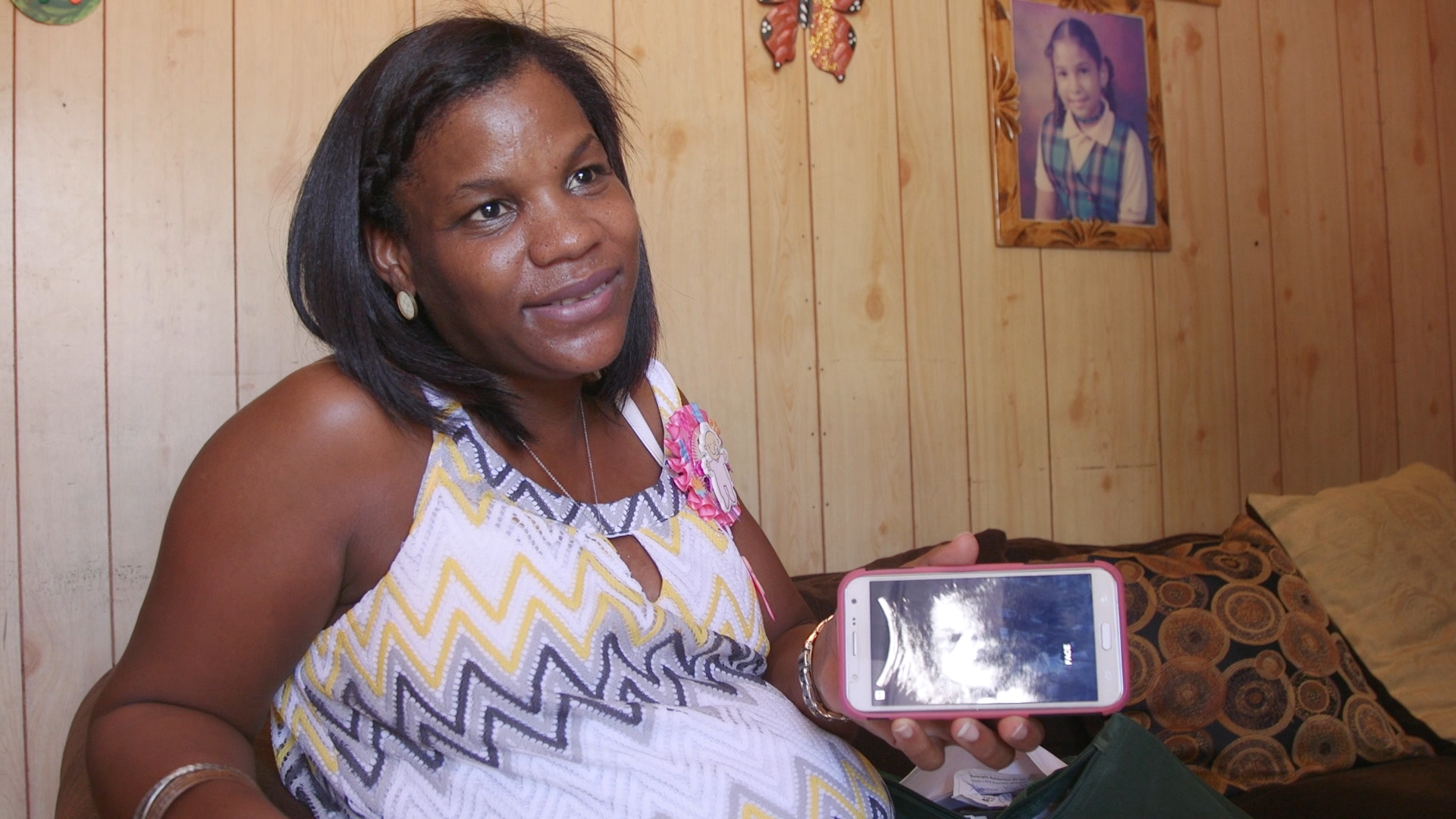A woman named Adriana shows an image of her expected child, but she's overwhelmed with worries about Zika. Click on the photo to see the whole story. (Photo via GroundTruth Films)