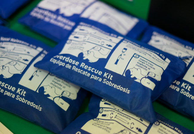 Naloxone rescue kits sit on the table at a drug clinic. (Photo by Edwin Torres/GroundTruth)