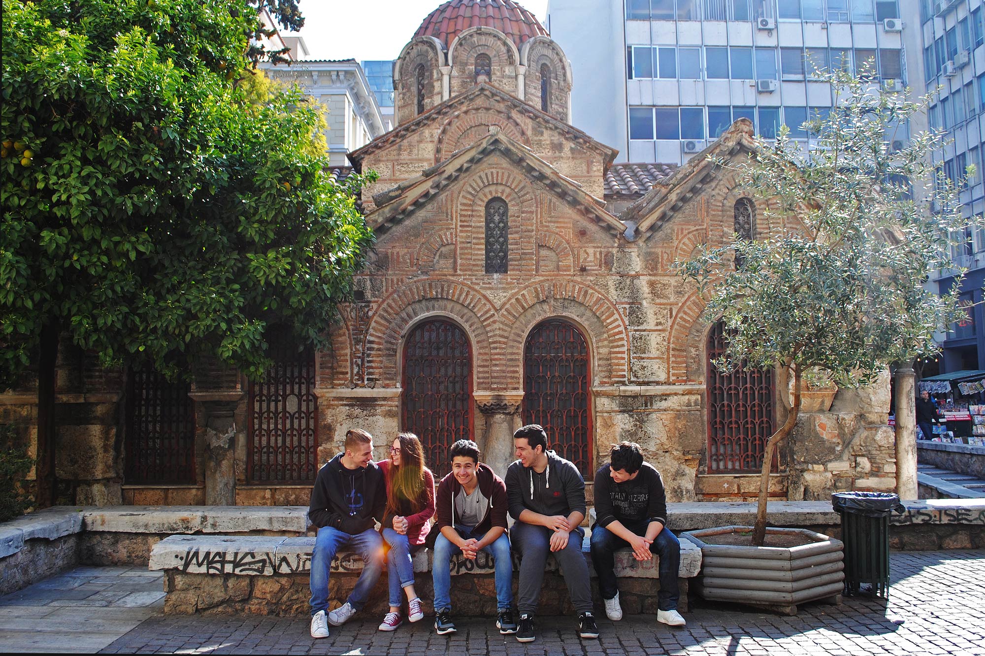 Greek youth gather outside a church in Athens. Secularization has caused more youth to spend their time outside the walls of the churches — despite religion playing a key factor in Greece's history and nationalism. (Jolene Latimer/GroundTruth)