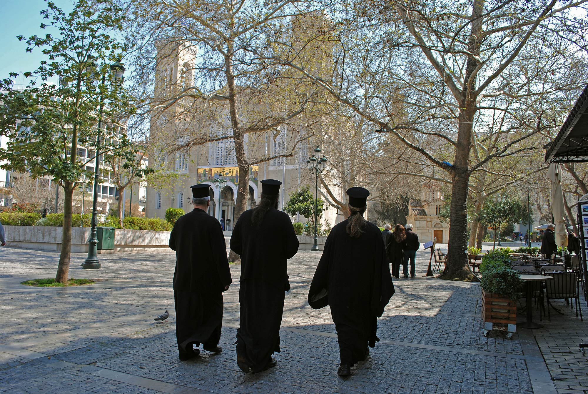 Greek Orthodox clergy walk through the streets of Athens. (Photo byJolene Latimer/GroundTruth)