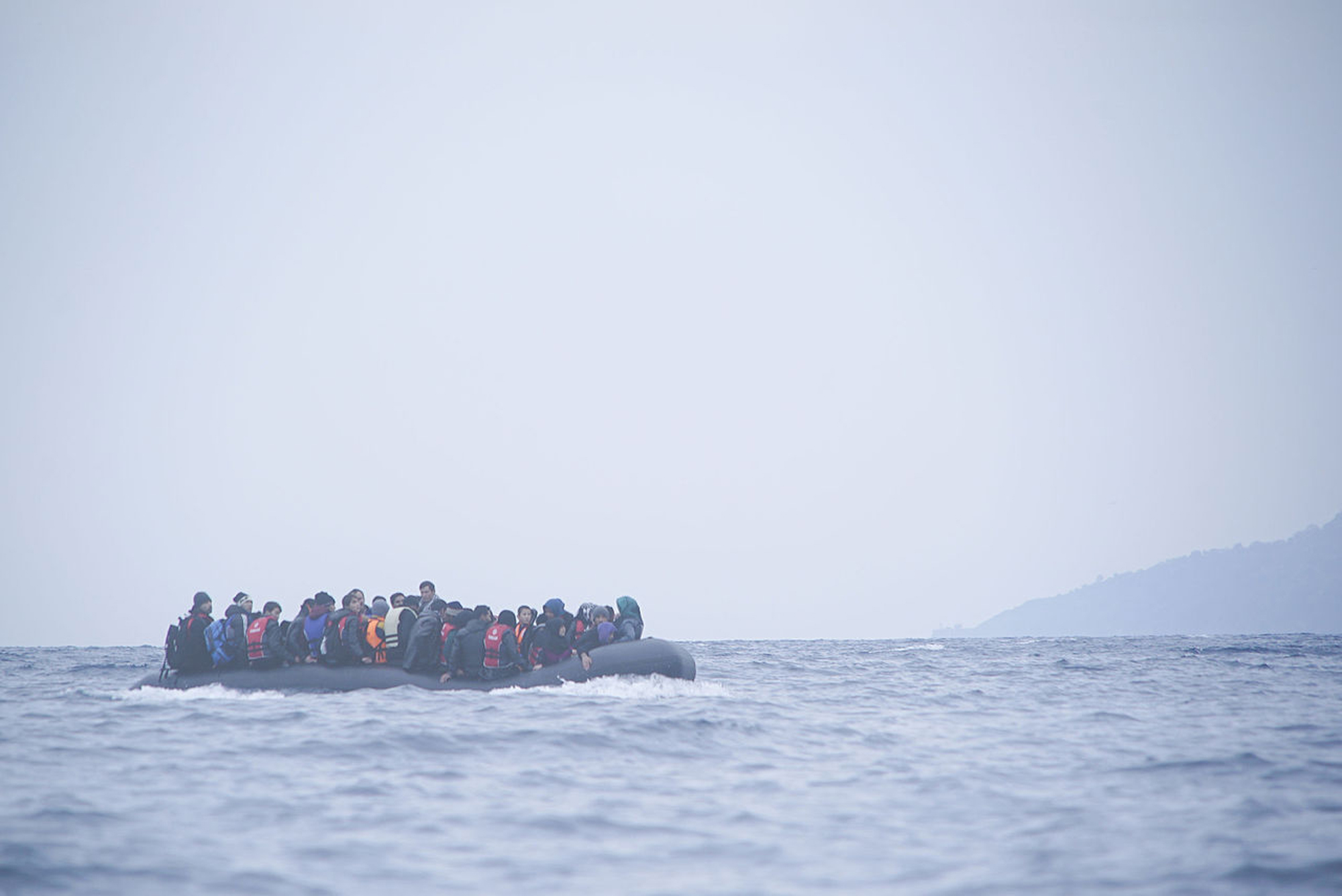 Refugees cross the Mediterranean sea on a boat in January 2016, heading from Turkish coast to Greece. (Photo via Wikimedia Commons)