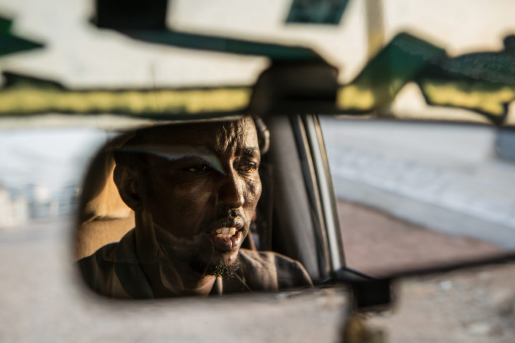 Abdulkadir Hasan Farah, a former pirate turned taxi driver, grew up in the seaside community of Eyl. Abdulkadir followed his father into the fishing business but the rise in illegal fishing made it increasingly difficult to earn a living. Twice foreign crews destroyed Abdulkadir’s nets, which were costly to replace. Broke and livid, he and some friends started taking guns out on their fishing trips to await foreign trawlers to hijack. (Photo by Nichole Sobecki/GroundTruth)