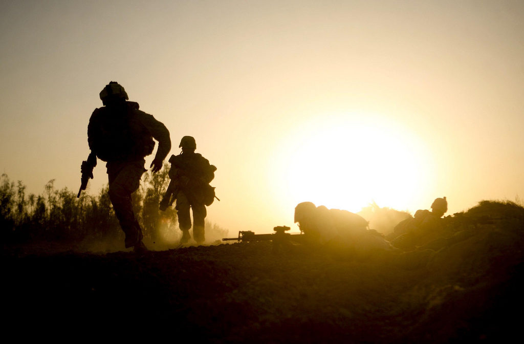 Marines with Company B, 1st Battalion, 5th Marine Regiment, Regimental Combat Team 3, run for cover during a fire fight in Nawa District, Helmand province, Afghanistan, Oct. 2, 2009. Dave Philipps covers veterans issues, and found out about suicidal veterans who had served in Afghanistan through a social media group they used. (Lance Cpl. John McCall via ISAF Public Affairs/Flickr Creative Commons)