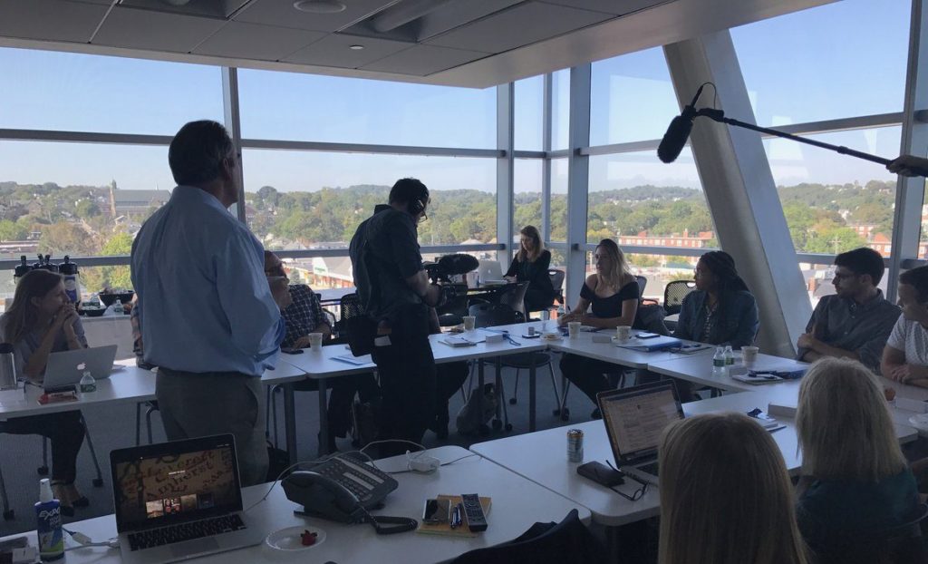 A team of 5 reporting fellows gathers at WGBH in Boston to kick off the Crossing the Divide reporting fellowship. (WGBH/GroundTruth)