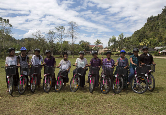 Girls in Chisec, Guatemala, receive bicycles from an initiative started by GroundTruth's Lauren Bohn, SchoolCycle. Bicycles allow girls to more easily travel to school, and give them autonomy over their own movement. (Lauren Bohn/GroundTruth)