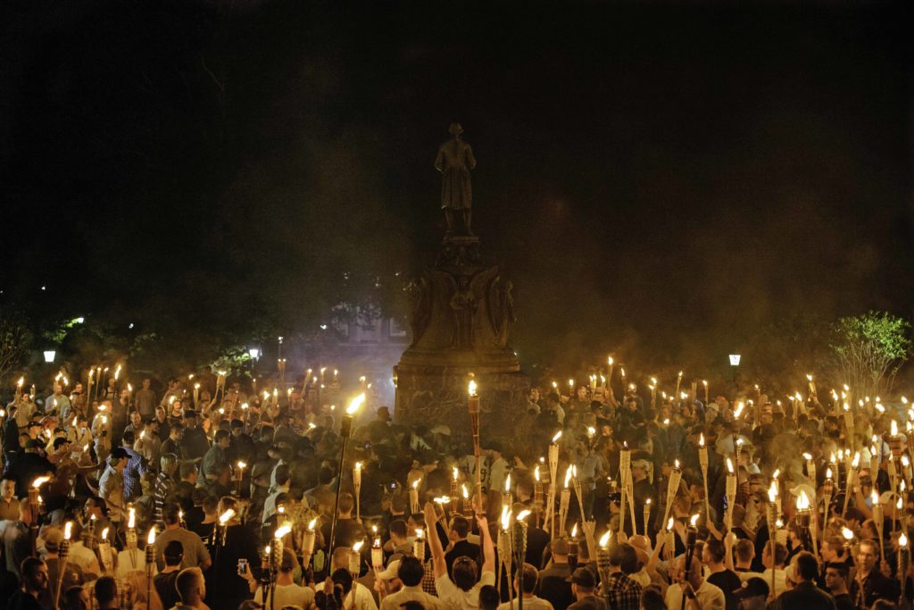 White supremacists marched to the Thomas Jefferson Memorial on the UVA campus. At the site, they were met by counter protesters who had planned on getting arrested for protesting against the white supremacists. August 11 , 2017 Charlottesville, VA. (Shay Horse/GroundTruth)