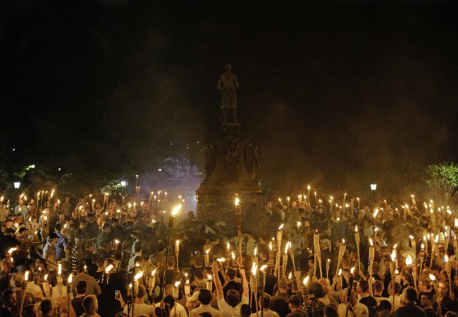 White supremacists marched to the Thomas Jefferson Memorial on the UVA campus. At the site, they were met by counter protesters who had planned on getting arrested for protesting against the white supremacists. August 11 , 2017 Charlottesville, VA. (Shay Horse/GroundTruth)