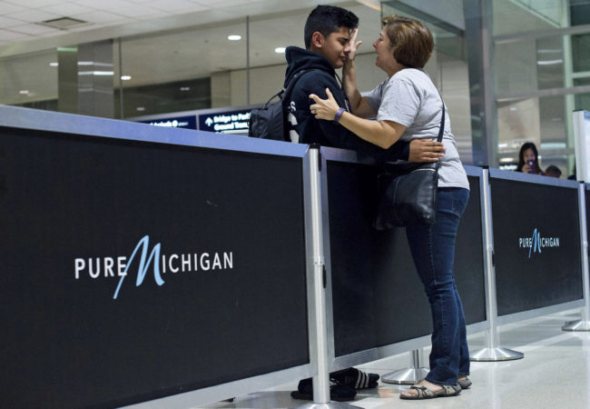 Bryan Quintana-Salazar, 13, cries as his former teacher, Jennifer Walsh