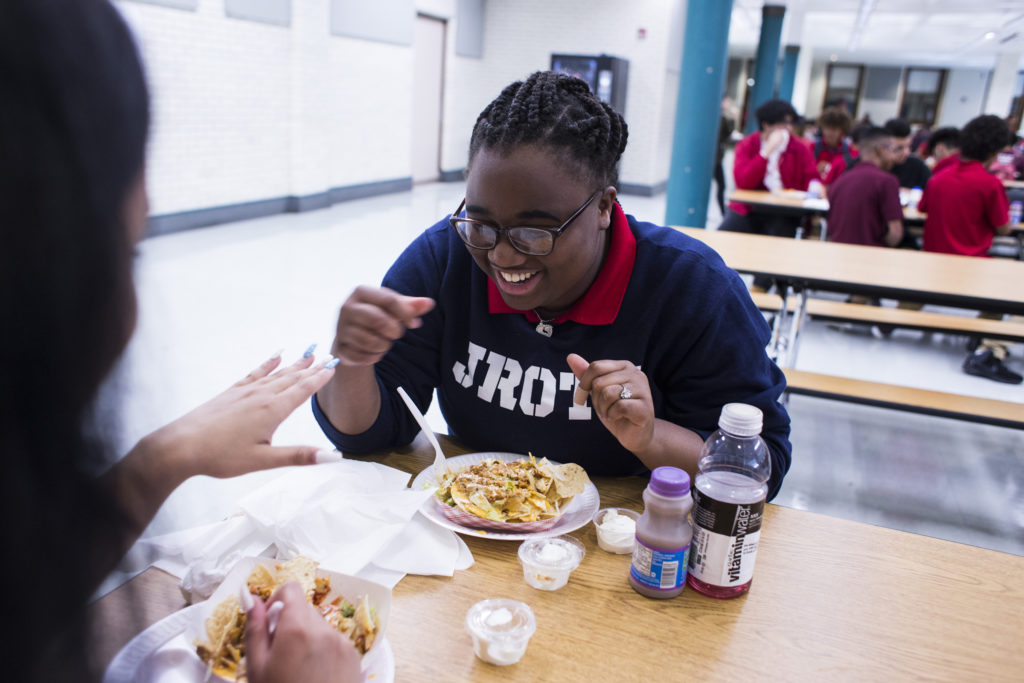 Tre'ana Taylor, 17, laughs as she examines her friends new set of nails during lunch time at the High School of Commerce in Springfield, Mass., on Monday, September, 11, 2017. (Photo by Brittany Greeson)