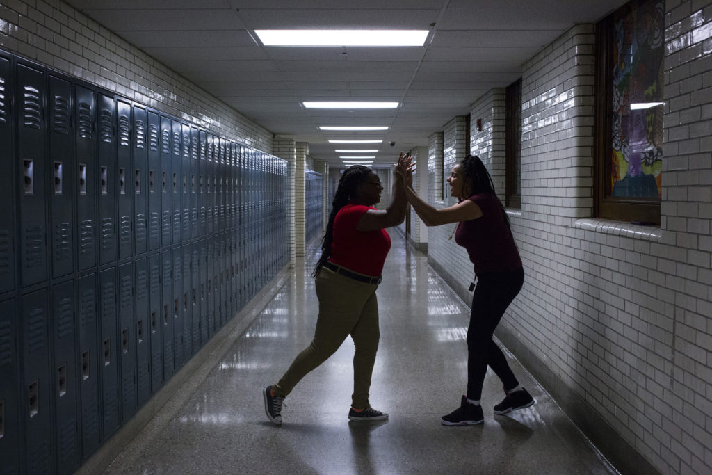 Tre'ana Taylor, 17, celebrates a successful step with a student she was teaching a step routine for JROTC at the High School of Commerce in Springfield, Mass., on Monday, September, 11, 2017. (Photo by Brittany Greeson)