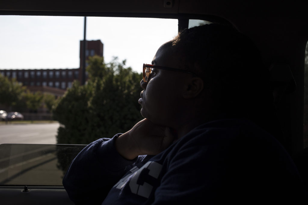 Tre'ana Taylor, 17, gazes at the cityscape out the window of a friend's car on her way home from school in Springfield, Mass., on Monday, September, 11, 2017. (Photo by Brittany Greeson)