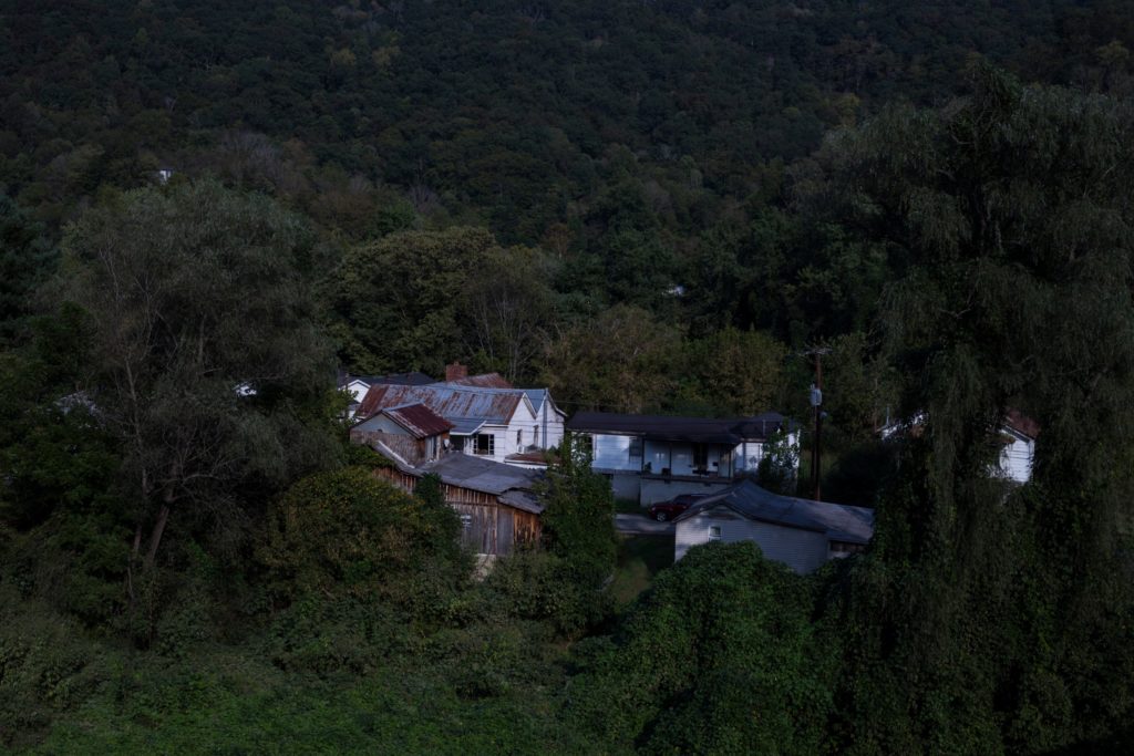 A cluster of homes are seen among a expanse of trees and kudzu from an overpass in Martin Ky., on Friday, September 22, 2017. (Photo by Brittany Greeson/GroundTruth)