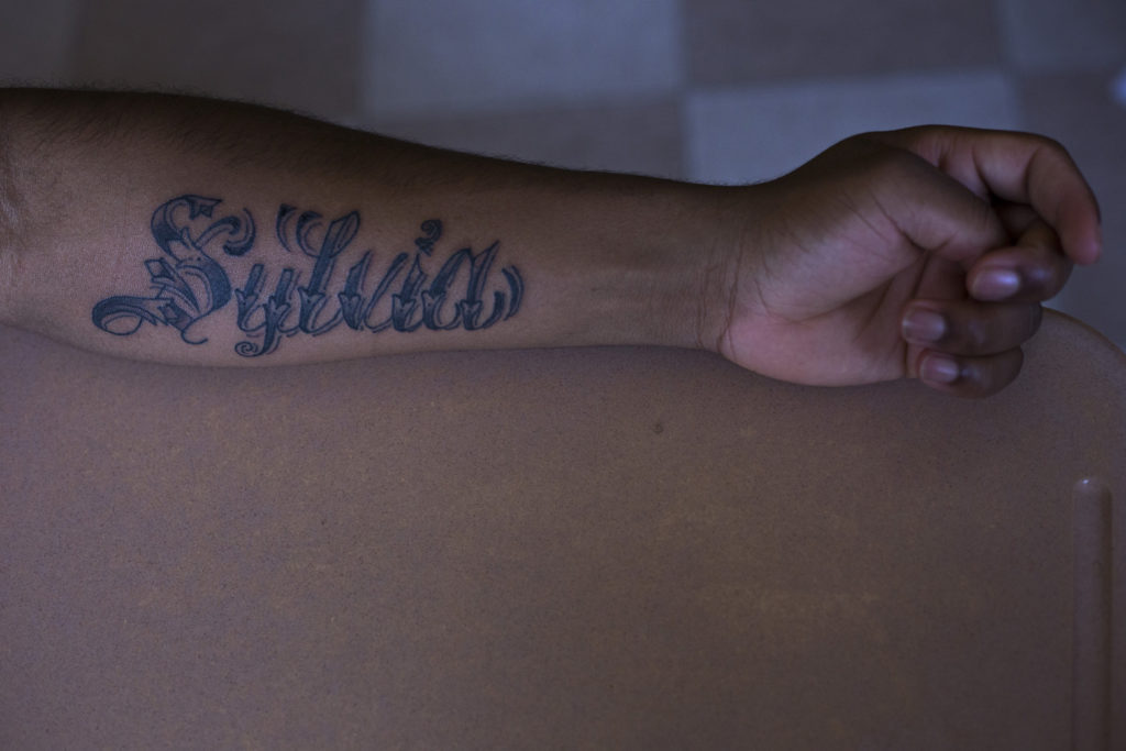 Vdremus Covington, 18, shows his new tattoo dedicated to his mother during his journalism class at the High School of Commerce in Springfield, Mass., on Monday, September, 11, 2017. "She's always looking out for me ... she'll be there for me when I need her to," Covington said. (Photo by Brittany Greeson)
