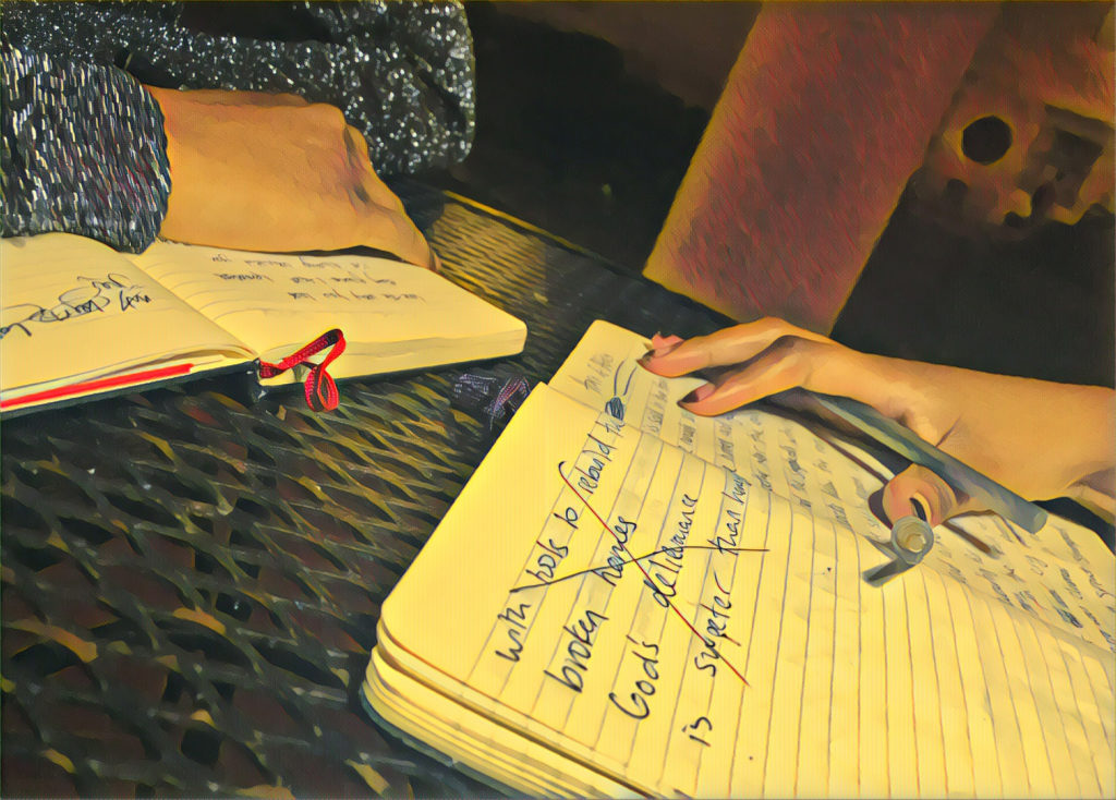 Amal Hussein and Hamdi Mohamed work on poems together (Photo by Ian Coss with Prisma filter)