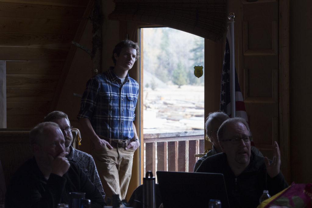 Zack Porter, of Missoula, listens in on the Southwestern Crown Collaborative quarterly meeting in Seeley Lake, Montana, on Thursday, October 19, 2017. (Photo by Brittany Greeson)
