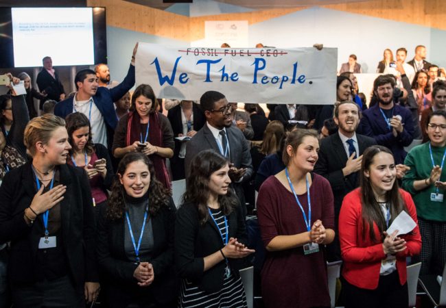 People disturb an event titled: "The Role of Cleaner and More Efficient Fossil Fuels and Nuclear Power in Climate Mitigation" with friendly singing at the COP 23 United Nations Climate Change Conference on November 13, 2017 in Bonn, Germany. The event, organized by the Trump administration and led by a delegation of U.S. coal, nuclear power and gas energy representatives, seeks to make the case for the ongoing use of the three power sources in bridging current global energy demand and the developing capacity of renewable energy sources. (Photo by Lukas Schulze/Getty Images)
