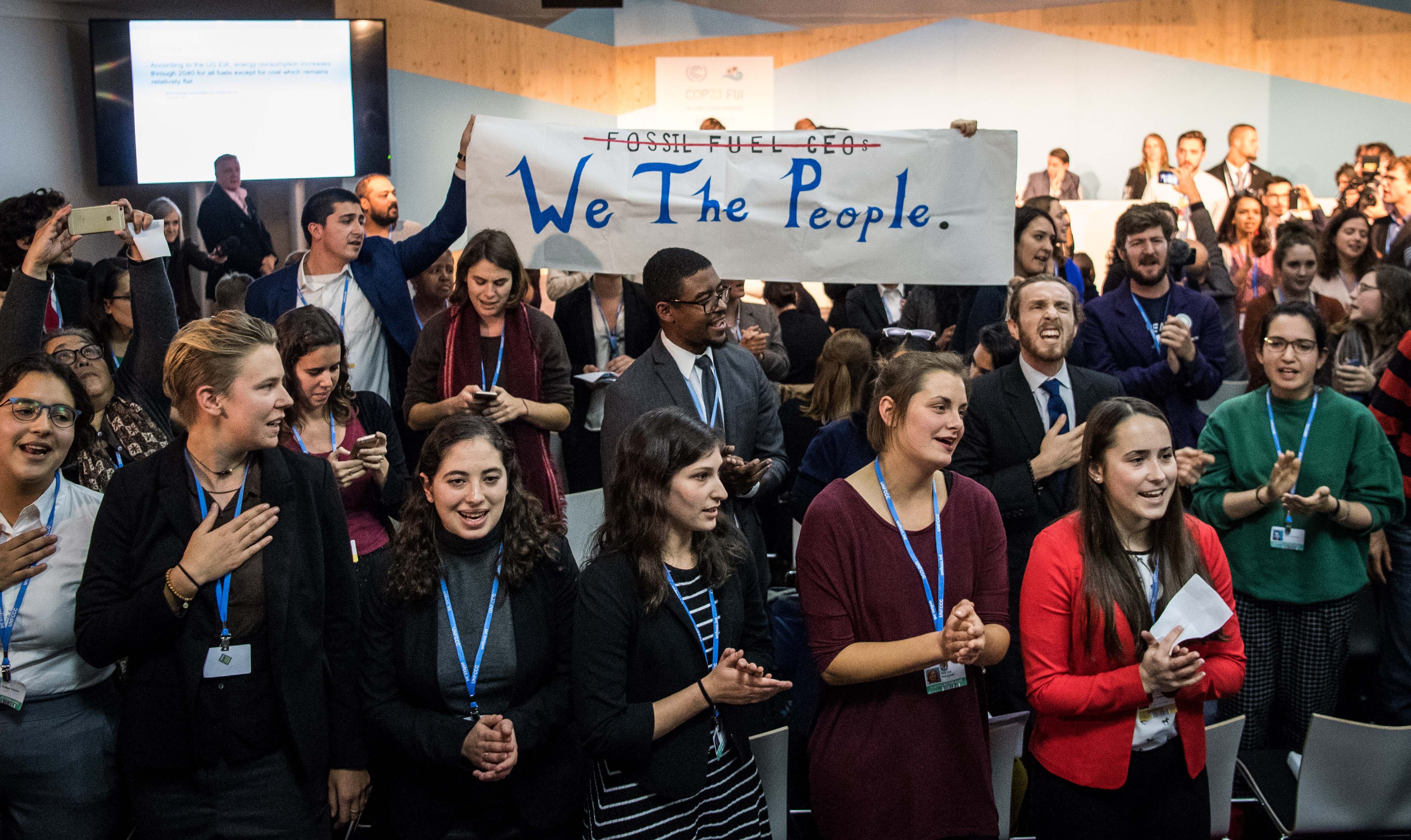 People disturb an event titled: "The Role of Cleaner and More Efficient Fossil Fuels and Nuclear Power in Climate Mitigation" with friendly singing at the COP 23 United Nations Climate Change Conference on November 13, 2017 in Bonn, Germany. The event, organized by the Trump administration and led by a delegation of U.S. coal, nuclear power and gas energy representatives, seeks to make the case for the ongoing use of the three power sources in bridging current global energy demand and the developing capacity of renewable energy sources. (Photo by Lukas Schulze/Getty Images)