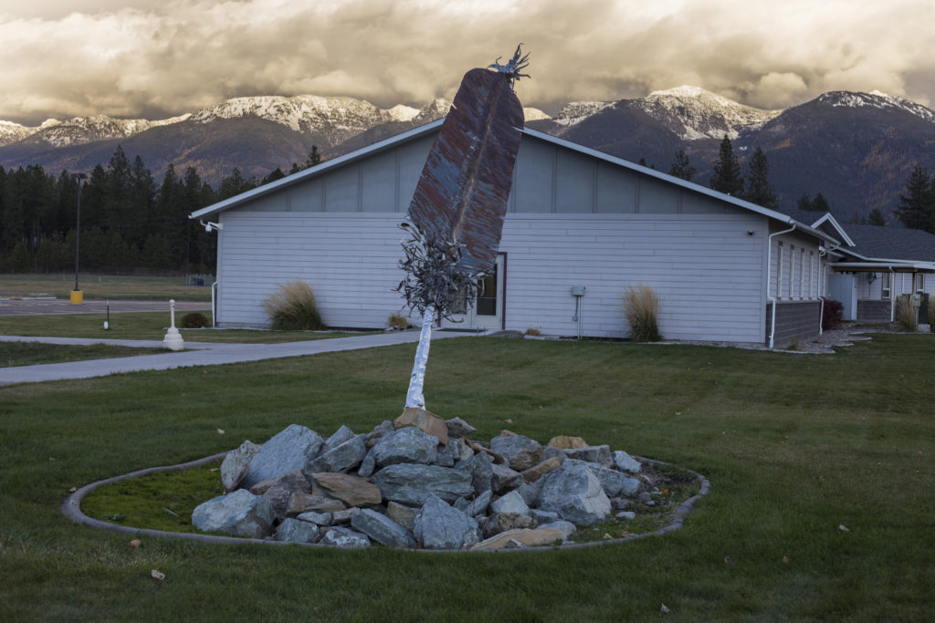 A sculpture of a feather sits nearby the Salish Kootenai College in Pablo, Montana, on Sunday, October 22, 2017. (Photo by Brittany Greeson)