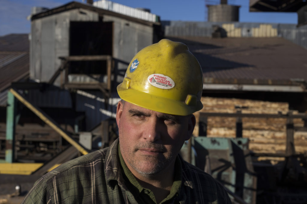 Todd Johnson, 52, stands outside of Pyramid Mountain Lumber Inc. in Seeley Lake, Montana, on Thursday, October 29, 2017. Pyramid Mountain is the oldest family owned and operated sawmill in the state of Montana. Johnson is a third generation worker for the sawmill. (Photo by Brittany Greeson)
