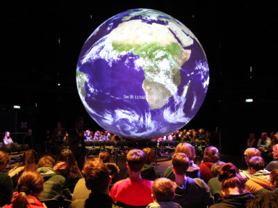German students inside the "Climate Planet" in Bonn, Germany, where the latest United Nations climate conference was held. (Katie Worth/GroundTruth)