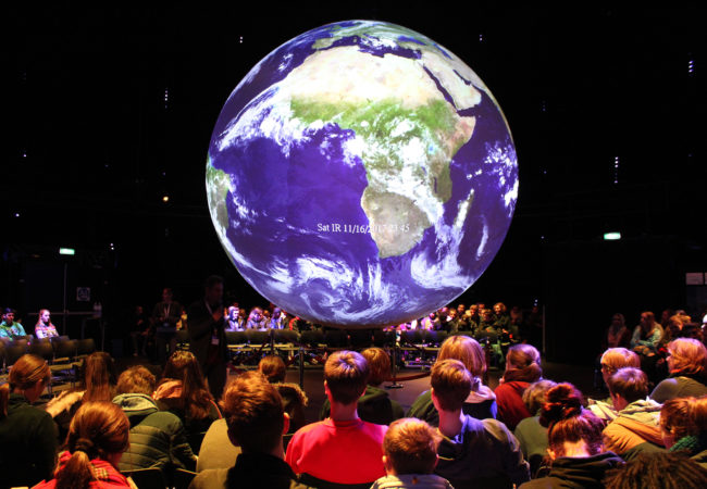 German students inside the "Climate Planet" in Bonn, Germany, where the latest United Nations climate conference was held. (Katie Worth/GroundTruth)