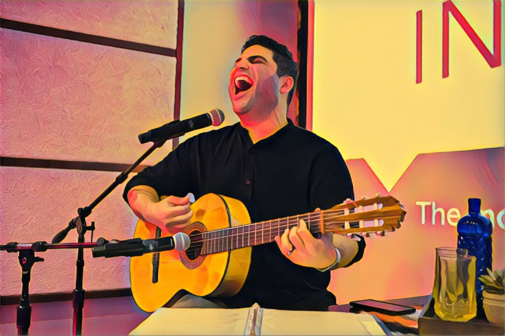 Omar Naré runs through a song prior to his show, VIVO: A Chicano Performance, at the BitWise, a tech hub with a long, rectangular theater in downtown Fresno, California, on Saturday, November 11, 2017. (Photo by Brittany Greeson with Prisma filter)