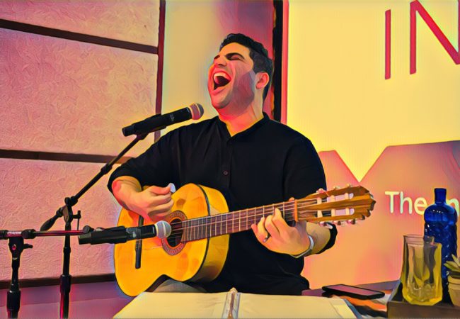 Omar Naré runs through a song prior to his show, VIVO: A Chicano Performance, at the BitWise, a tech hub with a long, rectangular theater in downtown Fresno, California, on Saturday, November 11, 2017. (Photo by Brittany Greeson with Prisma filter)