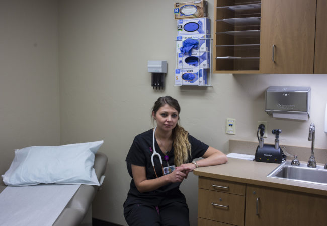 Kelsie Jones, 26, is a medical assistant in Polson, Montana. She is the one of the first graduates of the new medical assistant program at Salish and Kootenai College, an effort by the Confederated Salish and Kootenai Tribes to provide more job training opportunities in the healthcare field. (Brittany Greeson/GroundTruth)
