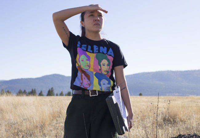 Fuels monitoring assistant Emily McCrea, 23, watches over a prescribed burn by the Confederated Salish and Kootenai Tribes Division of Fire just outside of Elmo, Mont., on Tuesday, October 24, 2017. McCrea was one of only two women working on the burn site that day. Tribes used prescribed burns long before European settlers arrived. Burns are made using a quilt technique that serves as a barrier preventing more intense fires from spreading. (Brittany Greeson/GroundTruth)