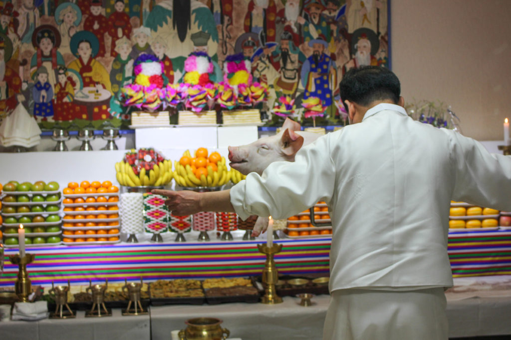 The pig was blessed before the official offering. This made the animal not only helpful for Choi, but also for anyone who ate it afterwards. (Miranda Mazariegos/GroundTruth)