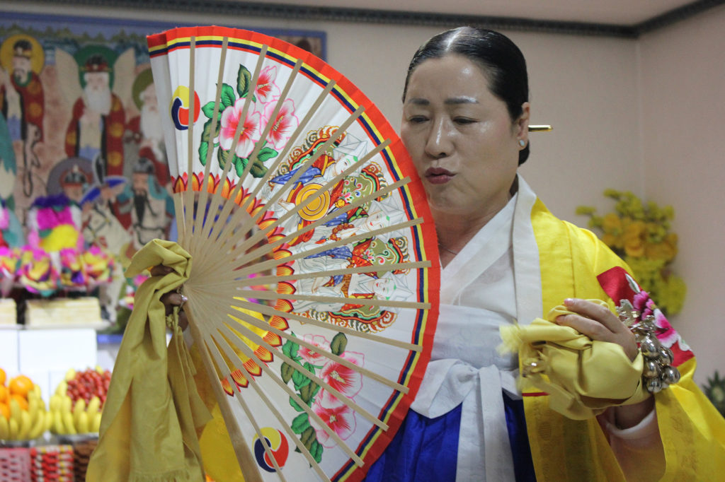 With political instability and an economic downturn, Koreans are turning to traditional shamanic ceremonies. (Miranda Mazariegos/GroundTruth)