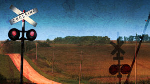Red Pick Up Truck Traveling Down a Dusty Midwest Road.