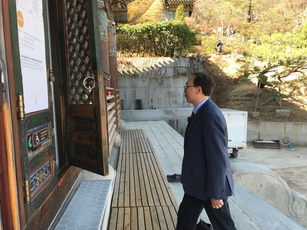 Wonyoung Sohn visits the 1,200-year-old Bongeunsa Temple. He has been advocating for inter-faith understanding, after incidents in which radical Christians vandalized Buddhist temples. (Chris Damien/GroundTruth)