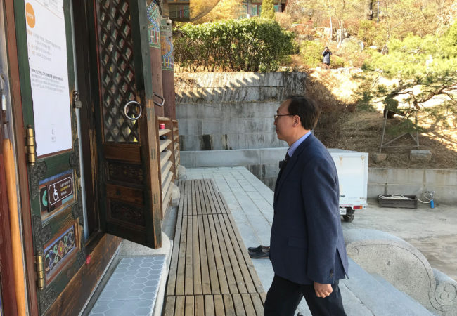 Wonyoung Sohn visits the 1,200-year-old Bongeunsa Temple. He has been advocating for inter-faith understanding, after incidents in which radical Christians vandalized Buddhist temples. (Chris Damien/GroundTruth)