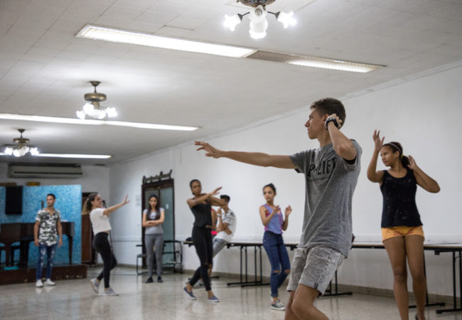 Abel Hernandez Eskenazi, front right, dances with other members of the youth organization at their weekly dance group May 14. Eskenazi, 17, has been leading religious services since his Bar Mitzvah four years ago. (Photo by Riley Robinson/The GroundTruth Project)
