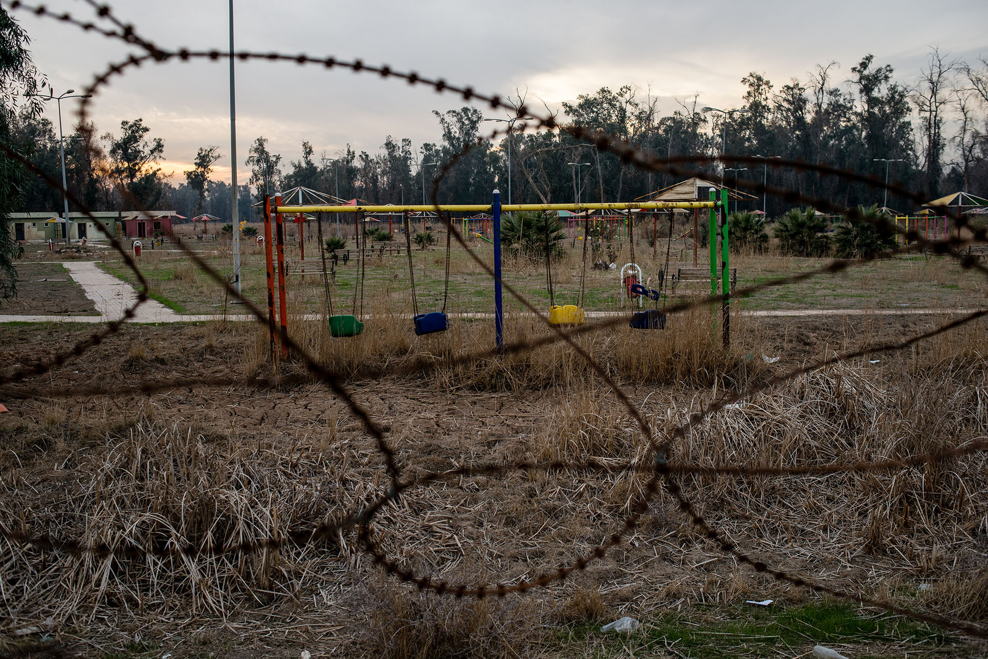 Swings sit empty in a playground city where two disabled boys were found wandering the grounds alone. (Alex Potter/GroundTruth)