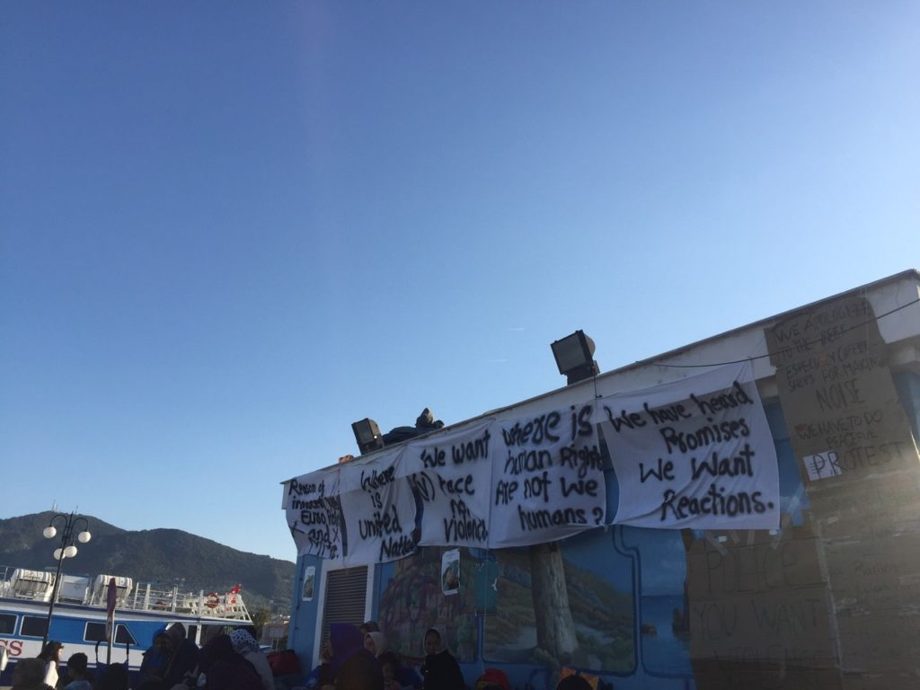 Signs from a recent protest at the refugee camp. (Photo by Holly Young/GroundTruth)