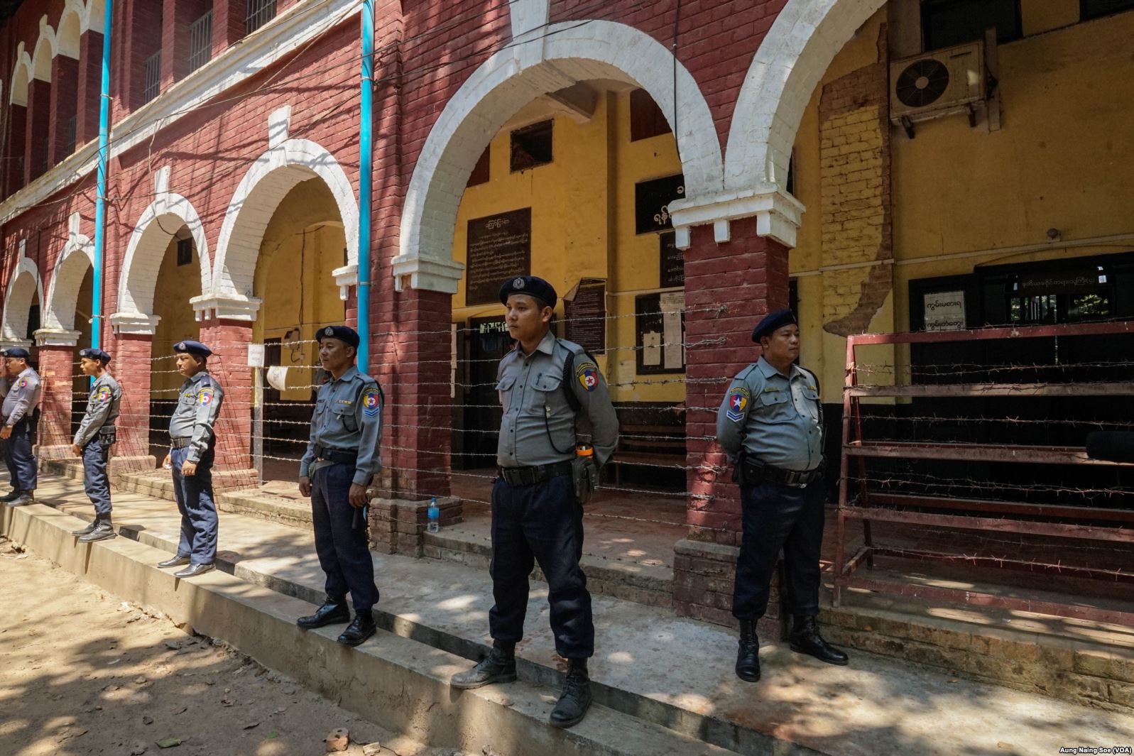 Myanmar Police officers stand on guard outside a courtroom in Insein Township during Wa Lone and Kyaw Soe Oo's trial.