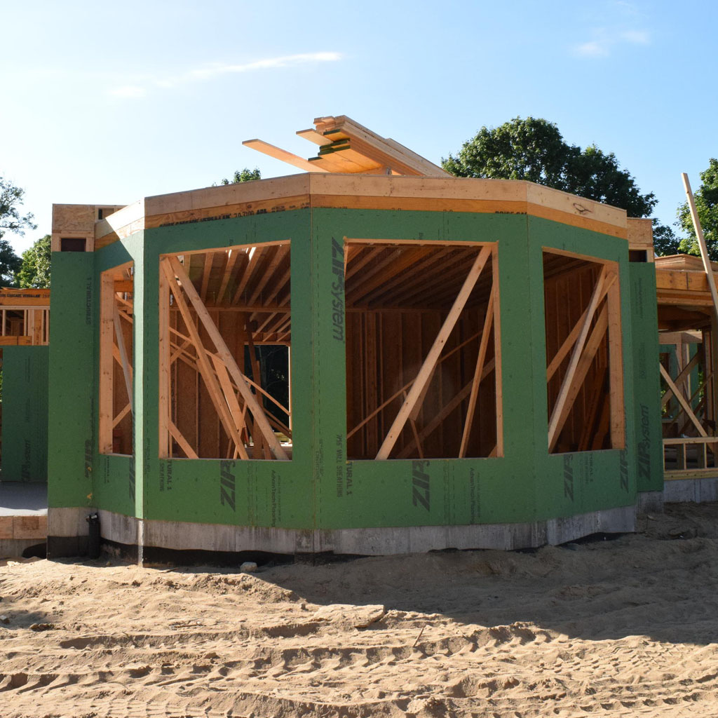 A new home in Orleans, Massachusetts, is built to withstand hurricanes, with strong, reinforced connections that hold the foundation to the walls. Credit Pien Huang/WCAI