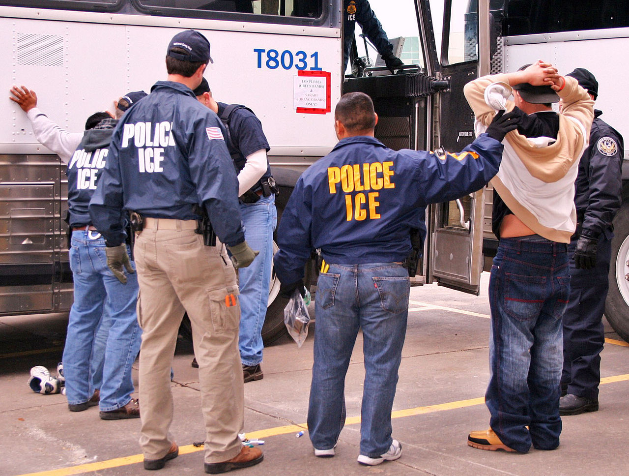 ICE agents detain a man in Houston. (Photo by ICE) 