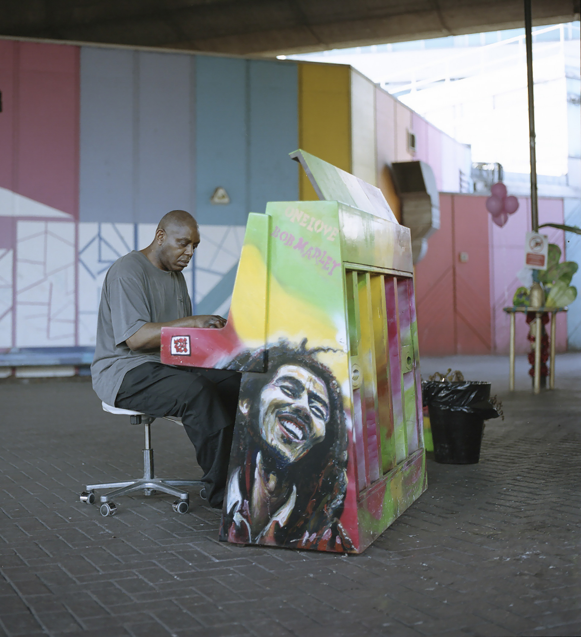 A local resident played on the public paino located outside The Wall of Truth, beneath the Westway.