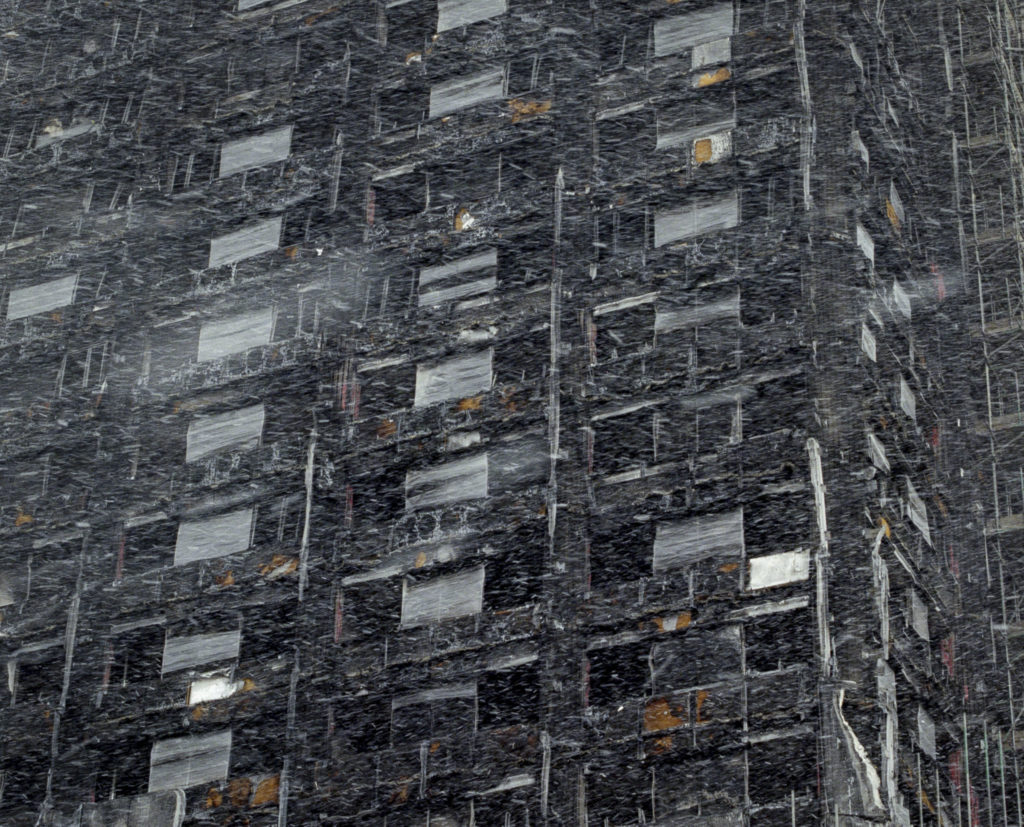 A fluke snow storm in March, swarmed around the skeletal remains of Grenfell Tower in London's North Kensington. (March, 2018)