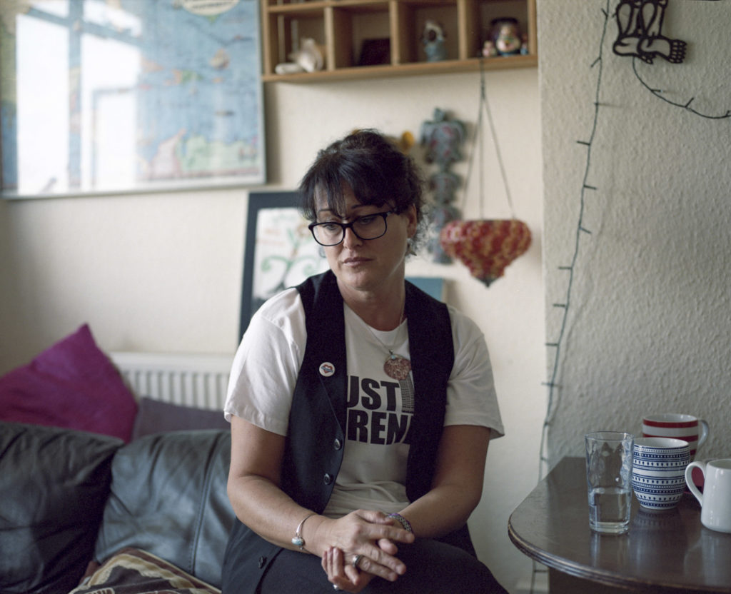 Elizabeth Stravoravdis of Kensal House W10, Resident for 26 years in North Kensington said,"Despite knowing how powerless we are, we are still carrying on for our children and our grandchildren. I like to think that even if they [the council] succeed in doing their social cleansing in this area, our children and grandchildren would've seen a heroism in us. Since the fire, I have seen survivors more than survive. I have seen them become warriors. These are the people who are still in temporary housing, who are still in hotels. I've seen the bereaved become conquerors. Because this is not normal to be crushed to such a point, where you turn into Hercules. Grenfell was like having a suit sewn to look pretty - but it wasnÕt actually sewn properly; you wear it once and it falls apart. And it's not as if we're short of talented architects or talented designers, or knowledge in structure. We can't build or renovate a simple building and make it stand or not burn down. How? Why? The answer is the money."