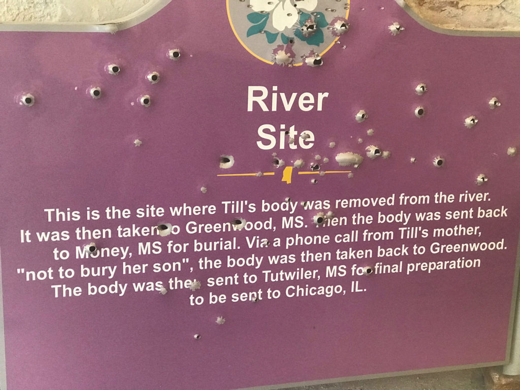 This sign that marks the place where Till's body was recovered was vandalized in recent weeks. (Photo by Alexandra Watts/GroundTruth)