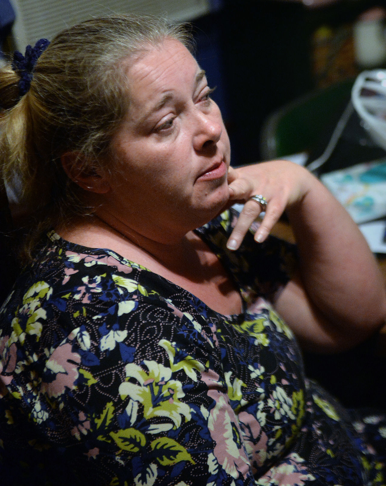 Tina Coleman sits in her home in Gary. Coleman, who grew up in McDowell County and moved her family back to the region several years ago, is looking for a new place to live in the county, as she's grown frustrated with the lack of clean water in her faucets. (Photo by F. Brian Ferguson | Gazette-Mail)